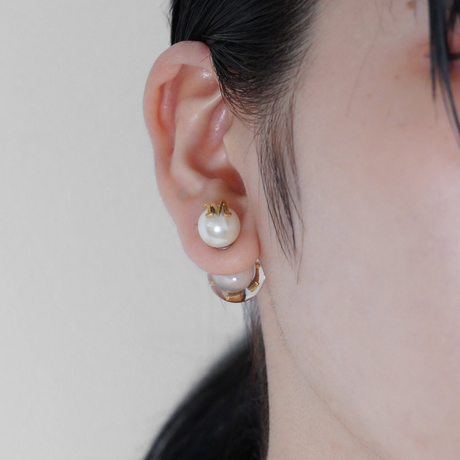 Initial inclusion pierce (white)