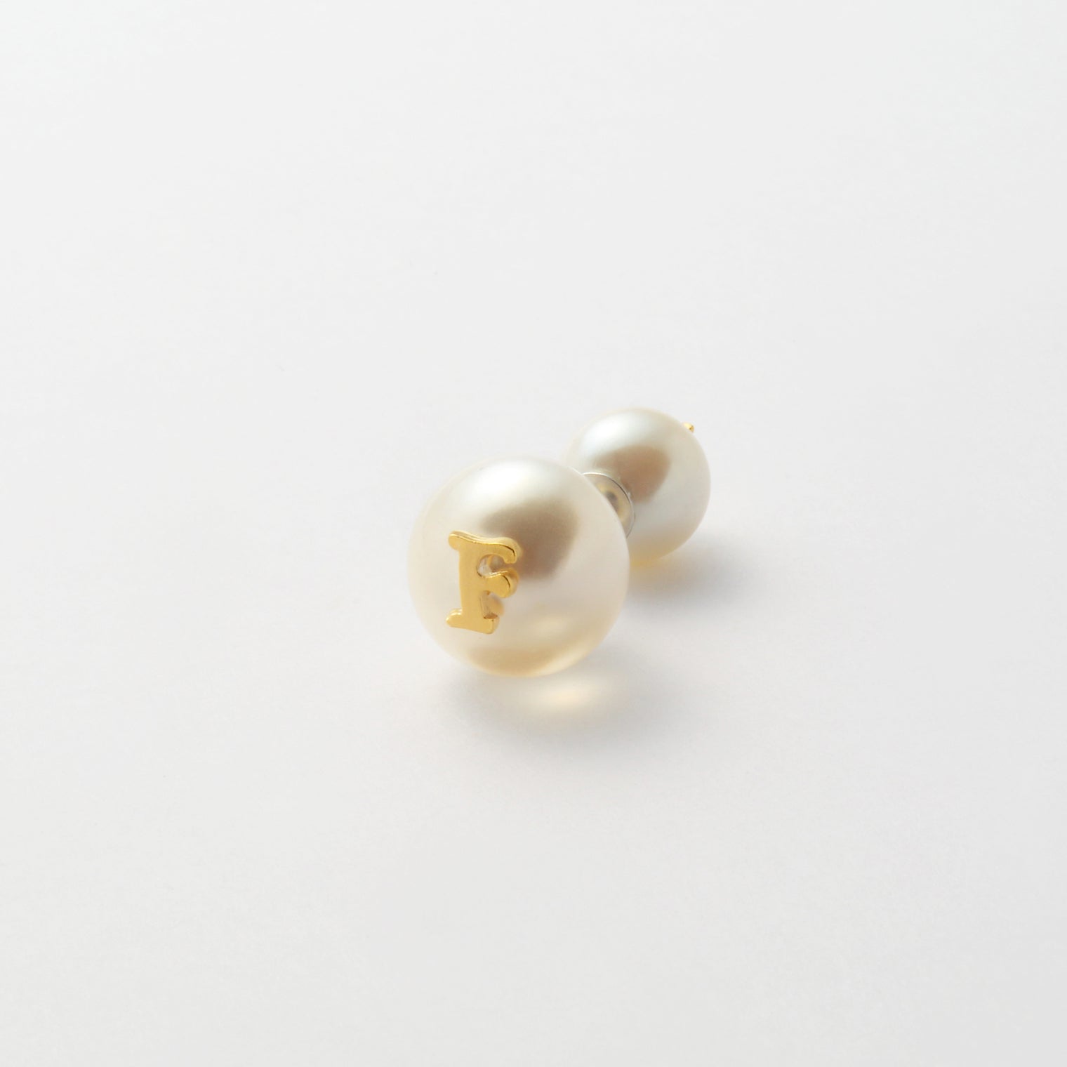 Initial inclusion pierce (white)