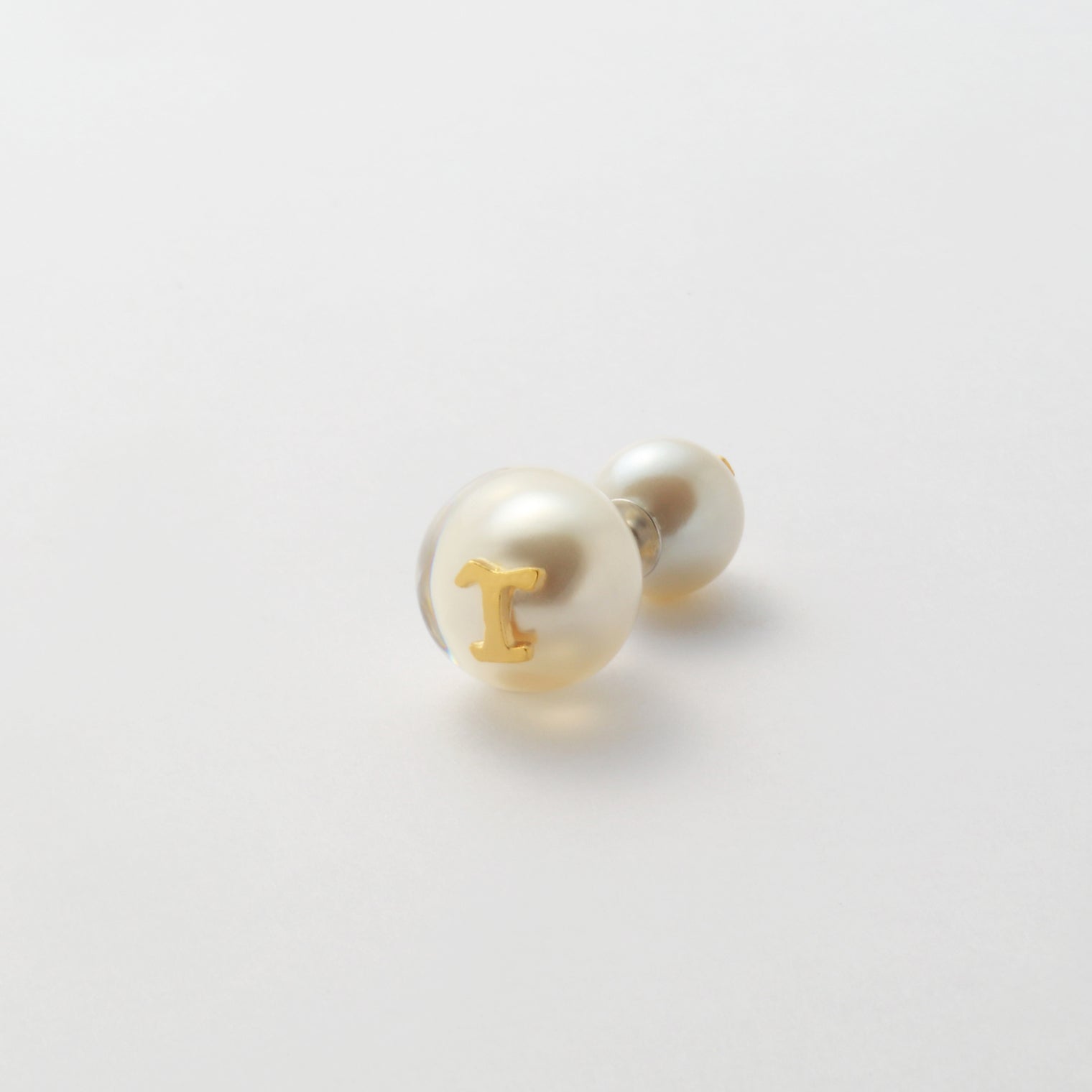 Initial inclusion pierce (white)