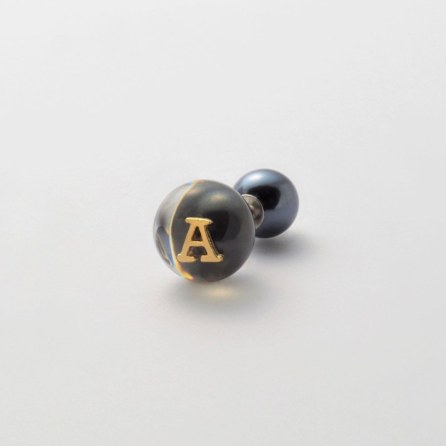 Initial inclusion pierce (black)