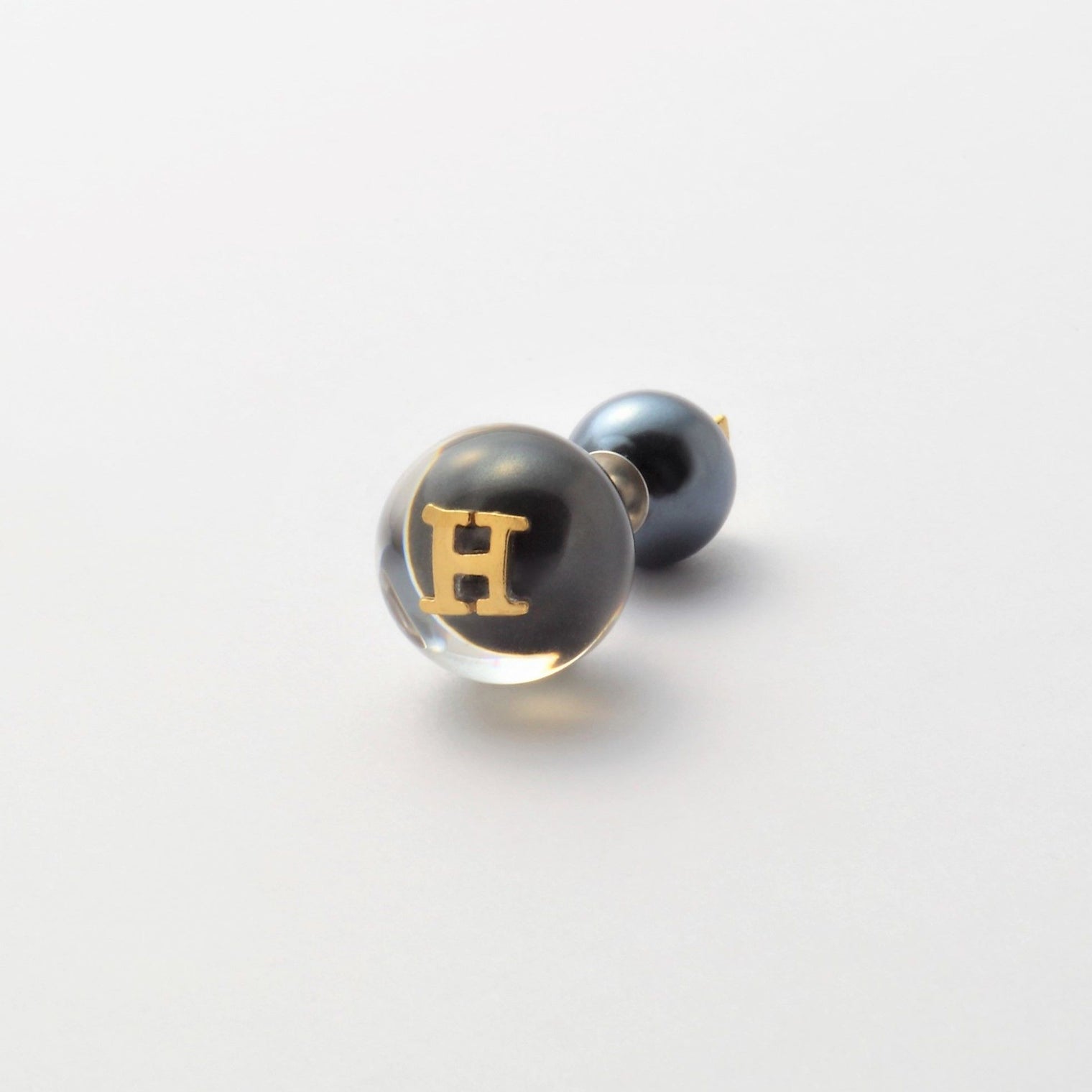 Initial inclusion pierce (black)