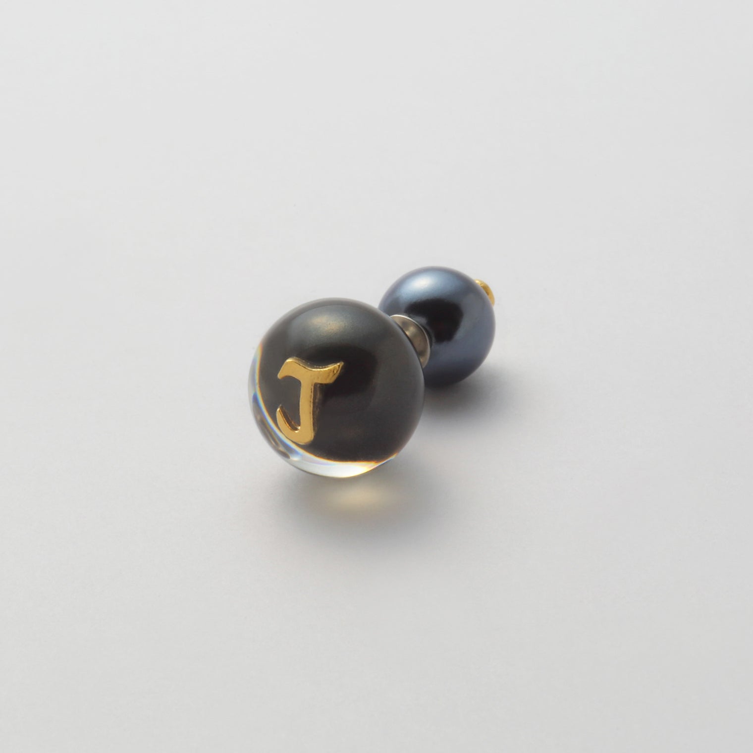 Initial inclusion pierce (black)