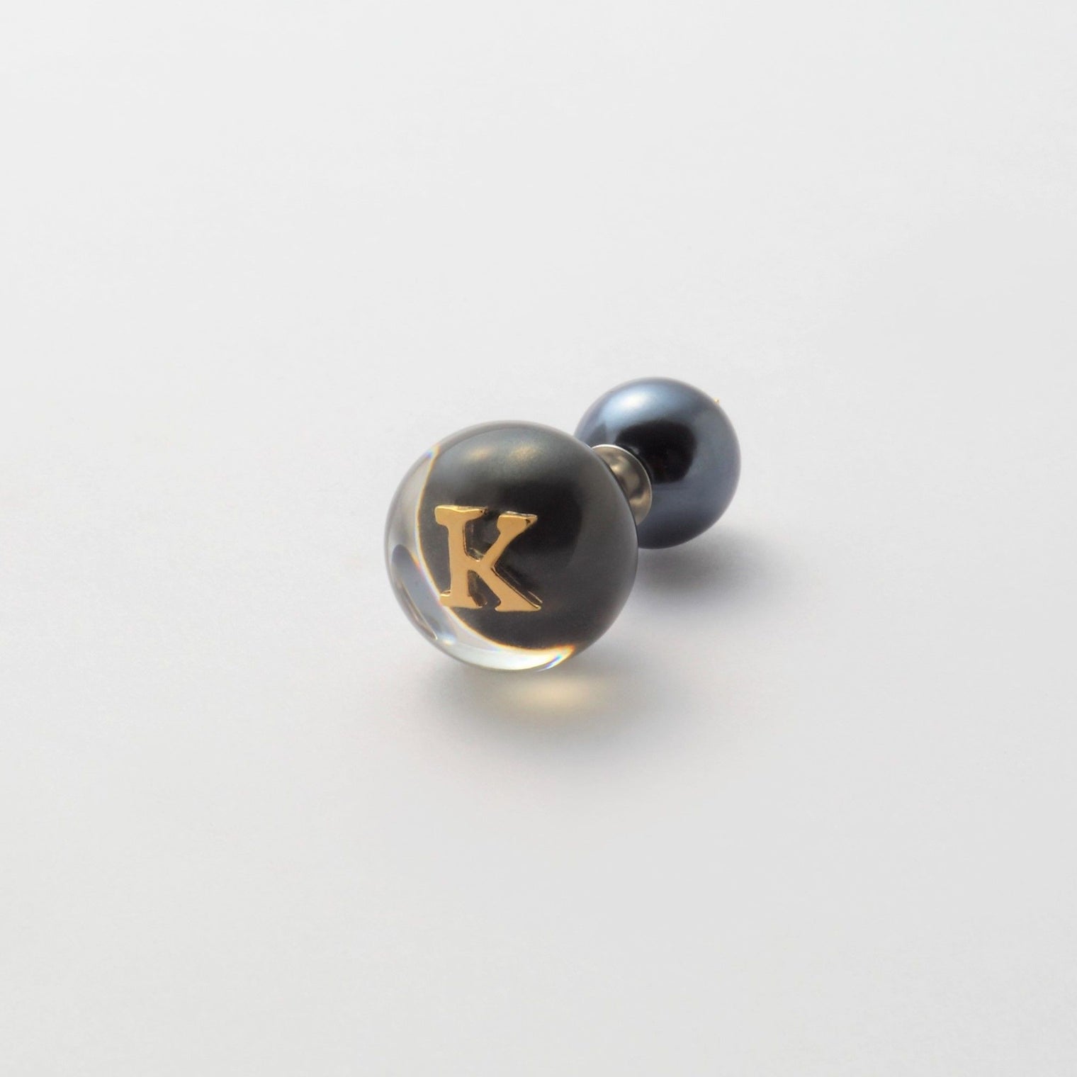 Initial inclusion pierce (black)
