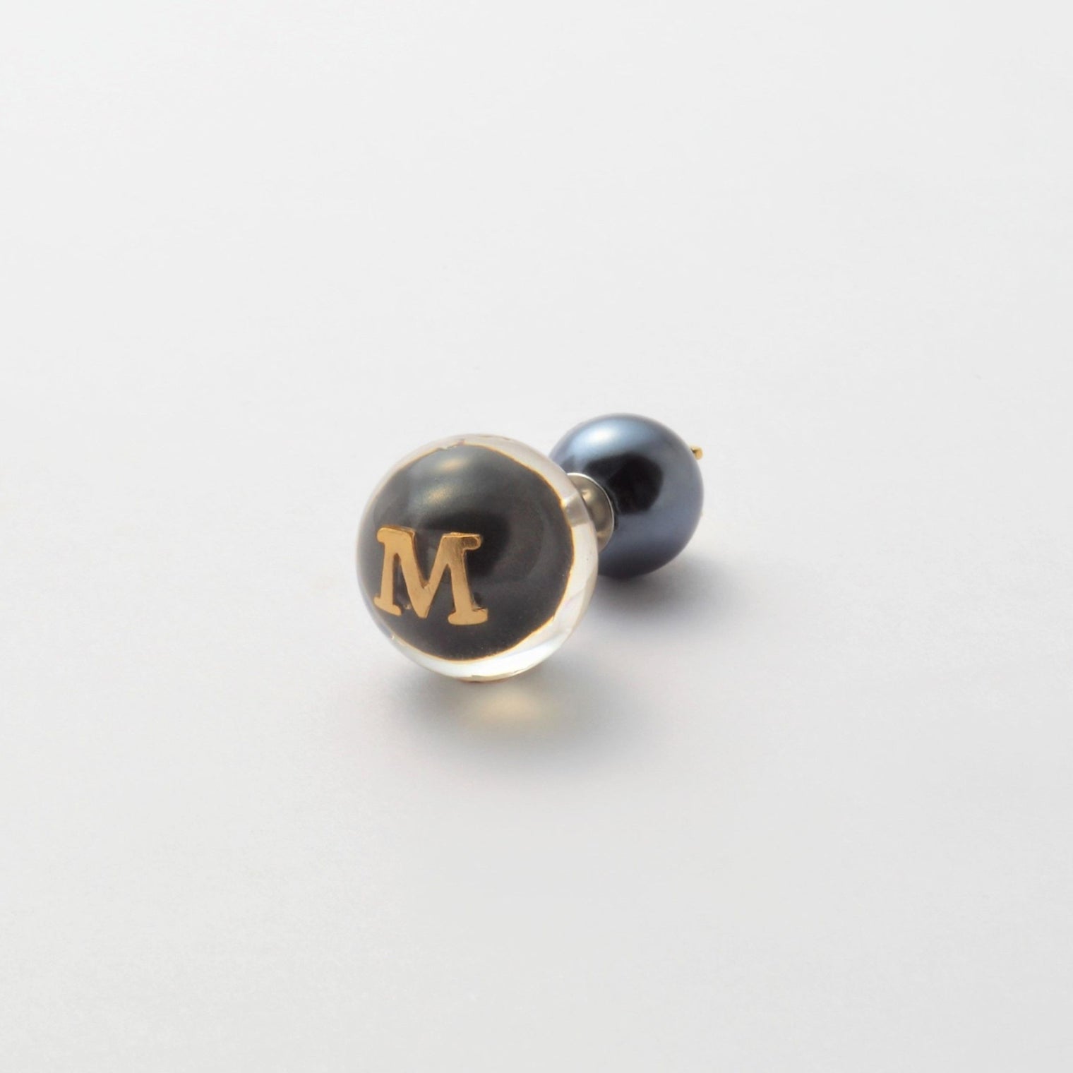 Initial inclusion pierce (black)