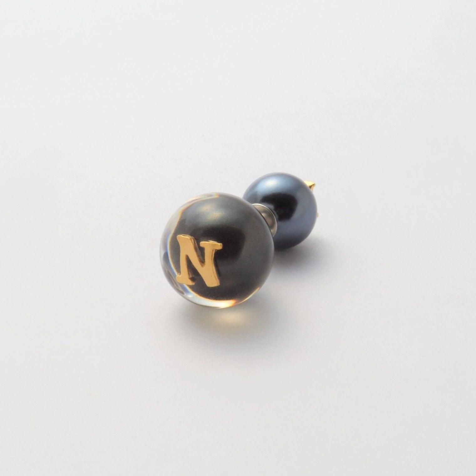 Initial inclusion pierce (black)