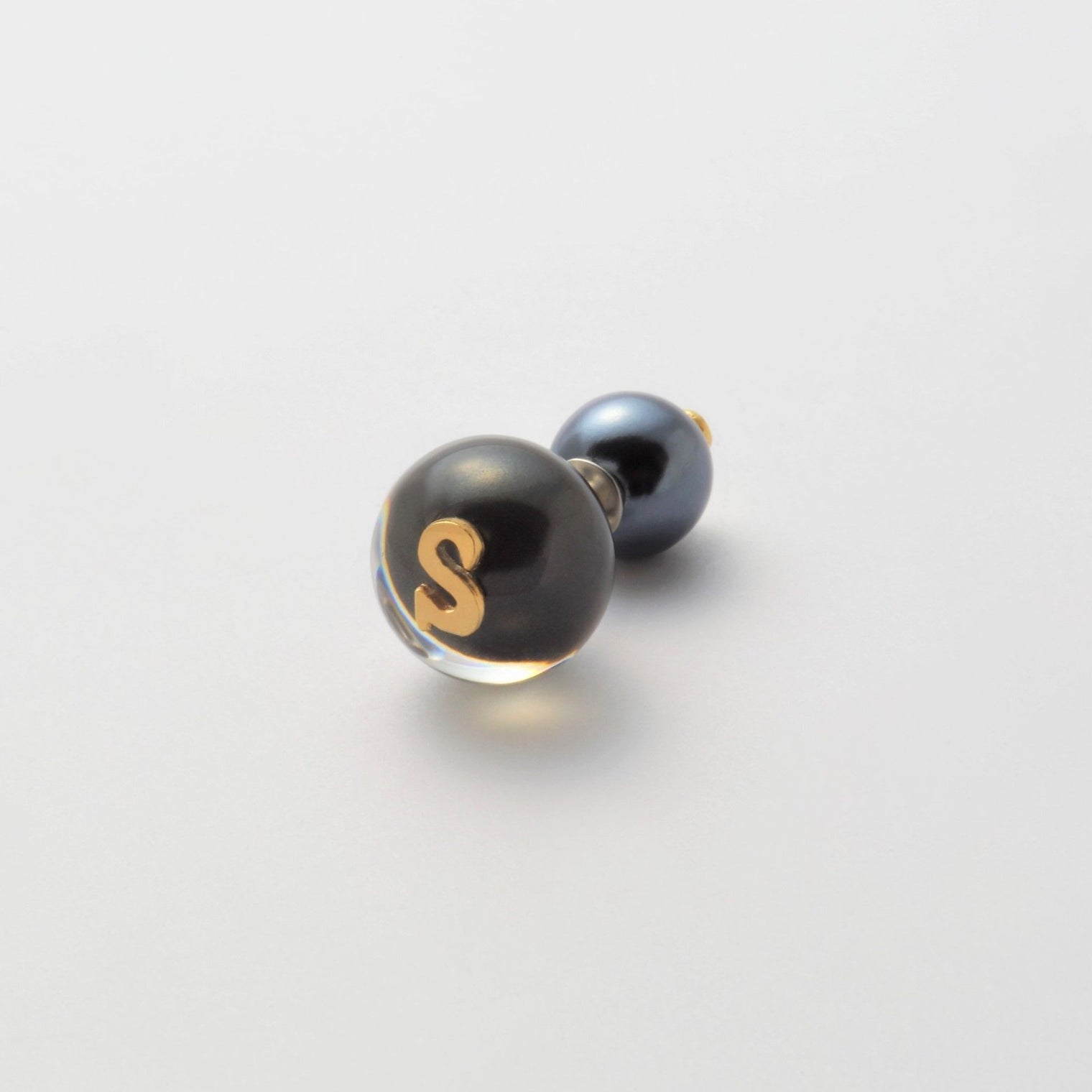 Initial inclusion pierce (black)