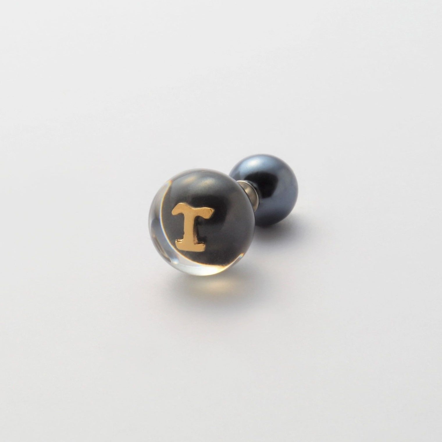 Initial inclusion pierce (black)