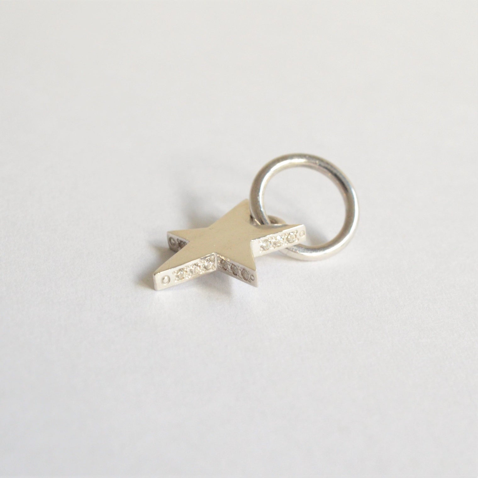 Tiny star line stone charm (cubic zirconia)