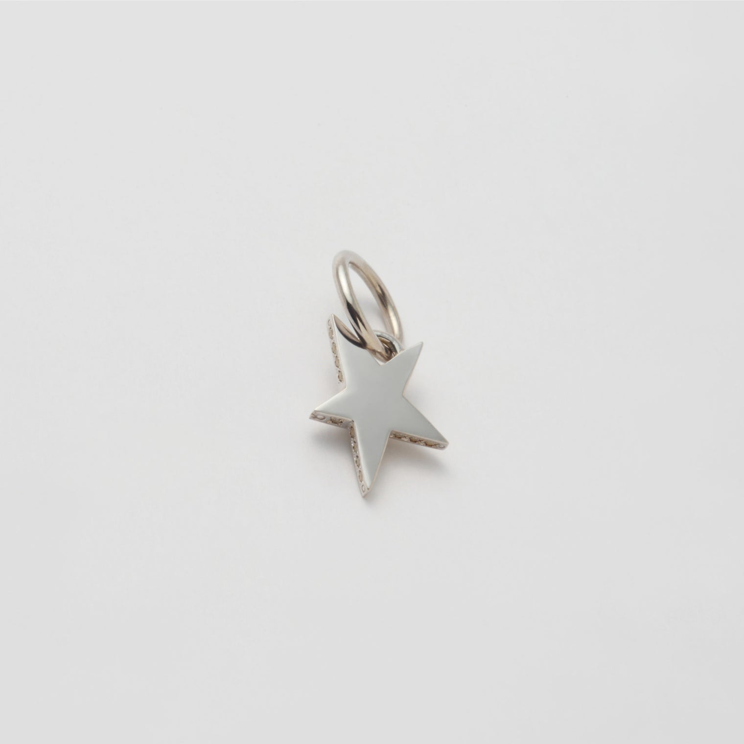 Tiny star line stone charm (cubic zirconia)