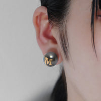 Initial inclusion pierce (black)