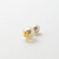 Initial inclusion pierce (white)