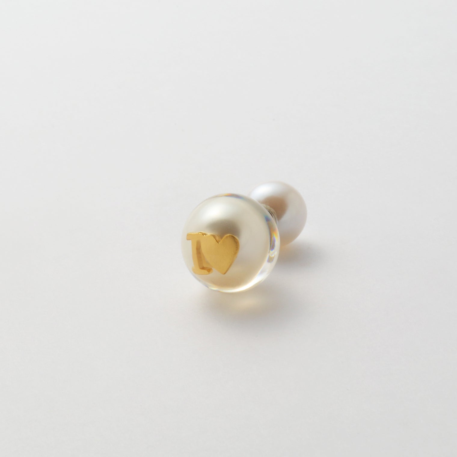 Initial inclusion pierce (white)