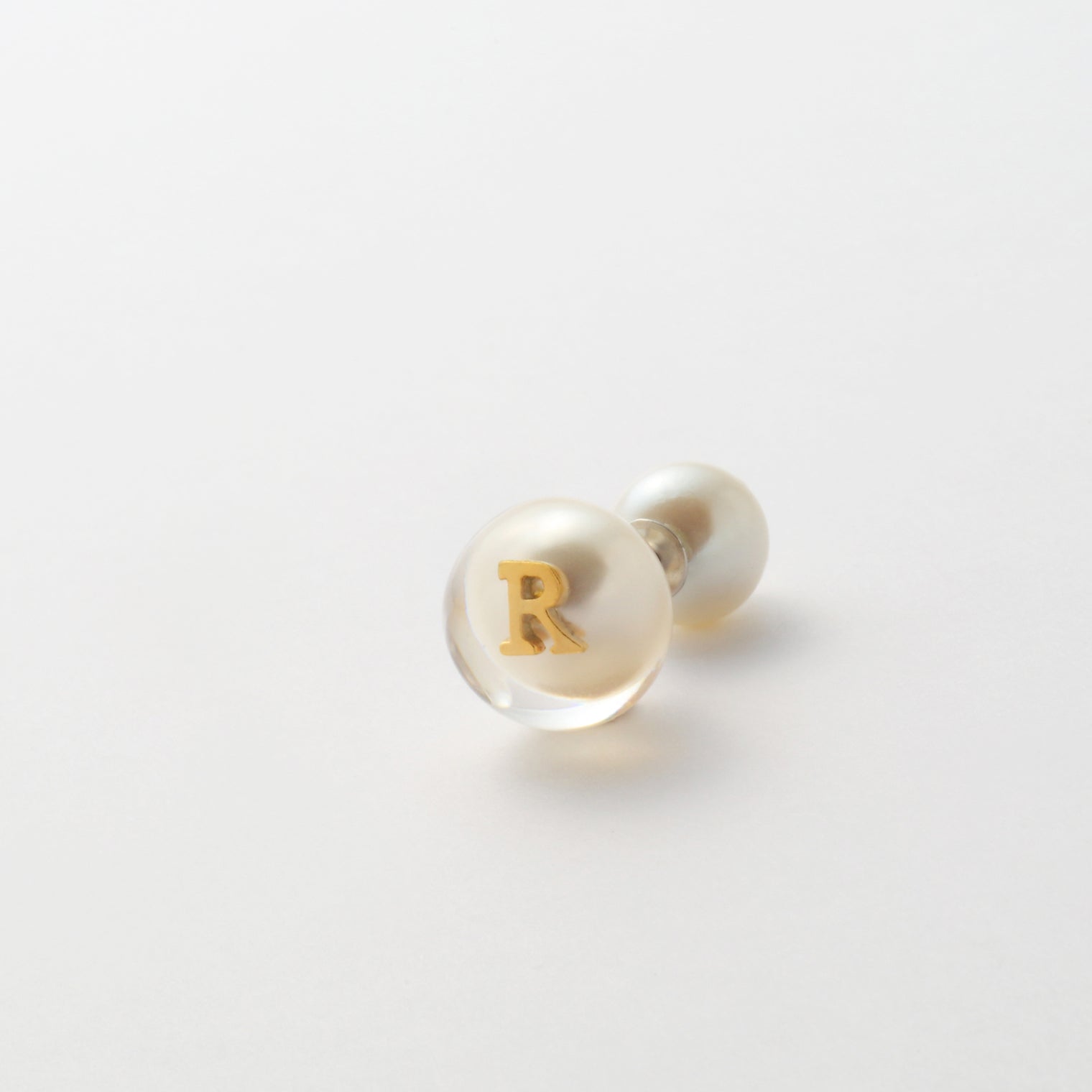Initial inclusion pierce (white)