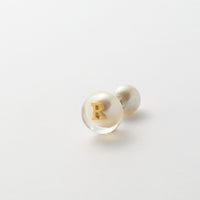 Initial inclusion pierce (white)