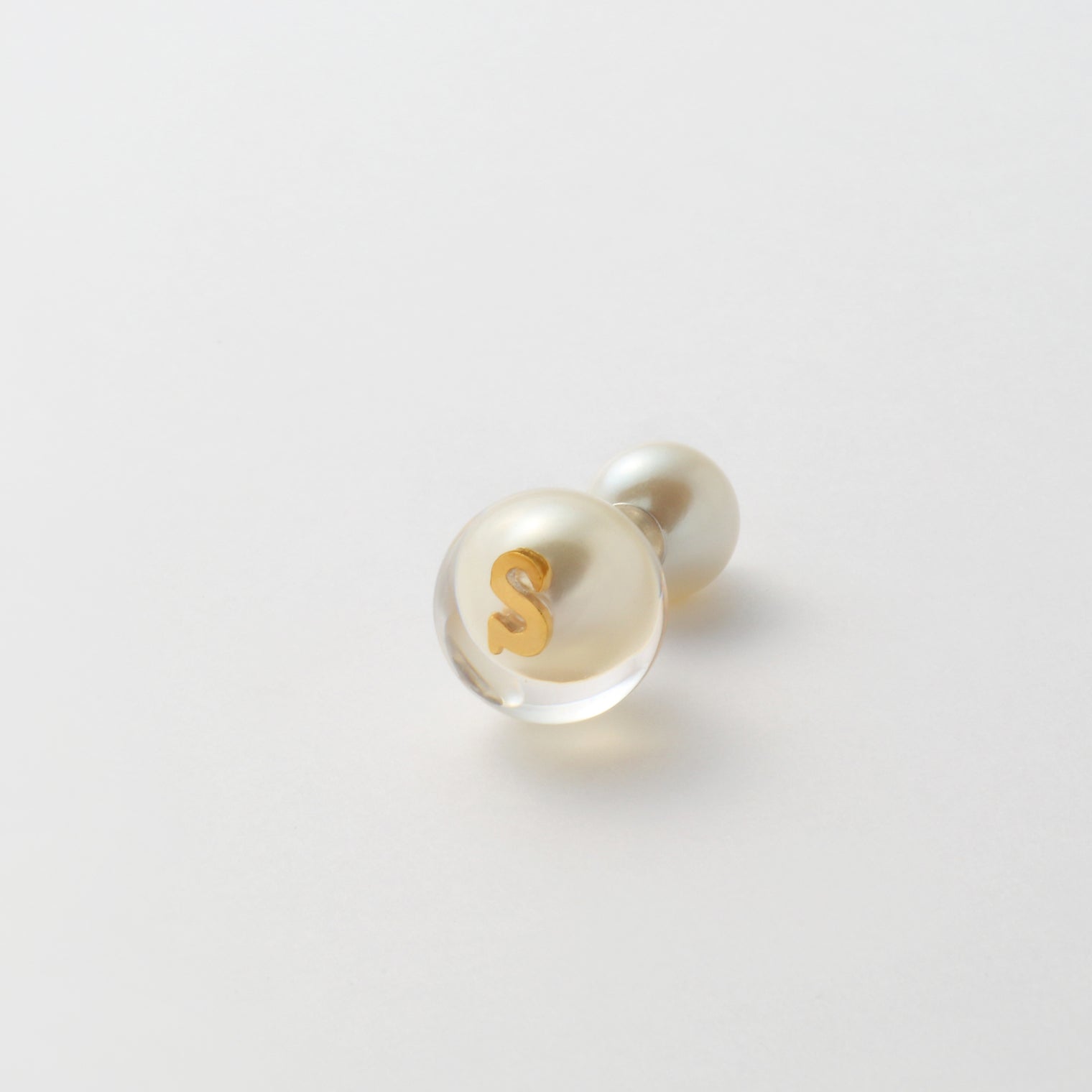 Initial inclusion pierce (white)