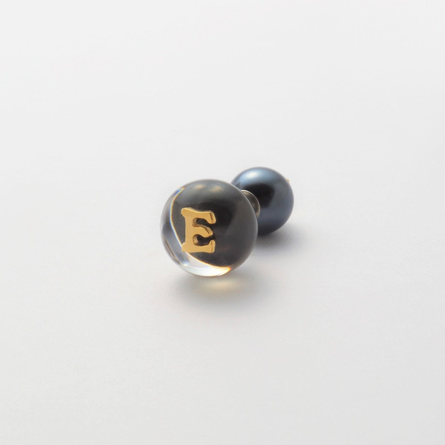 Initial inclusion pierce (black)